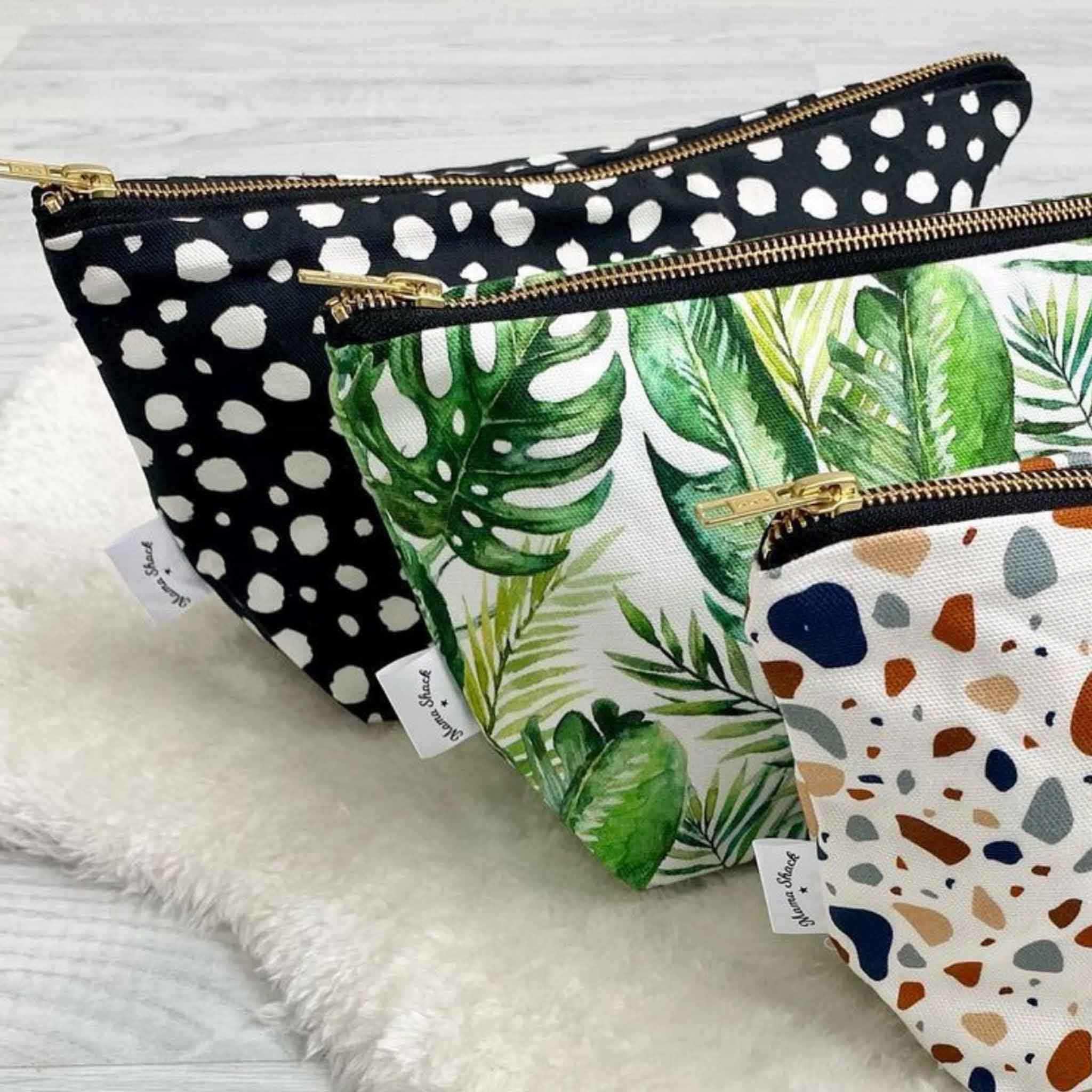 black spotty changing bag pouch