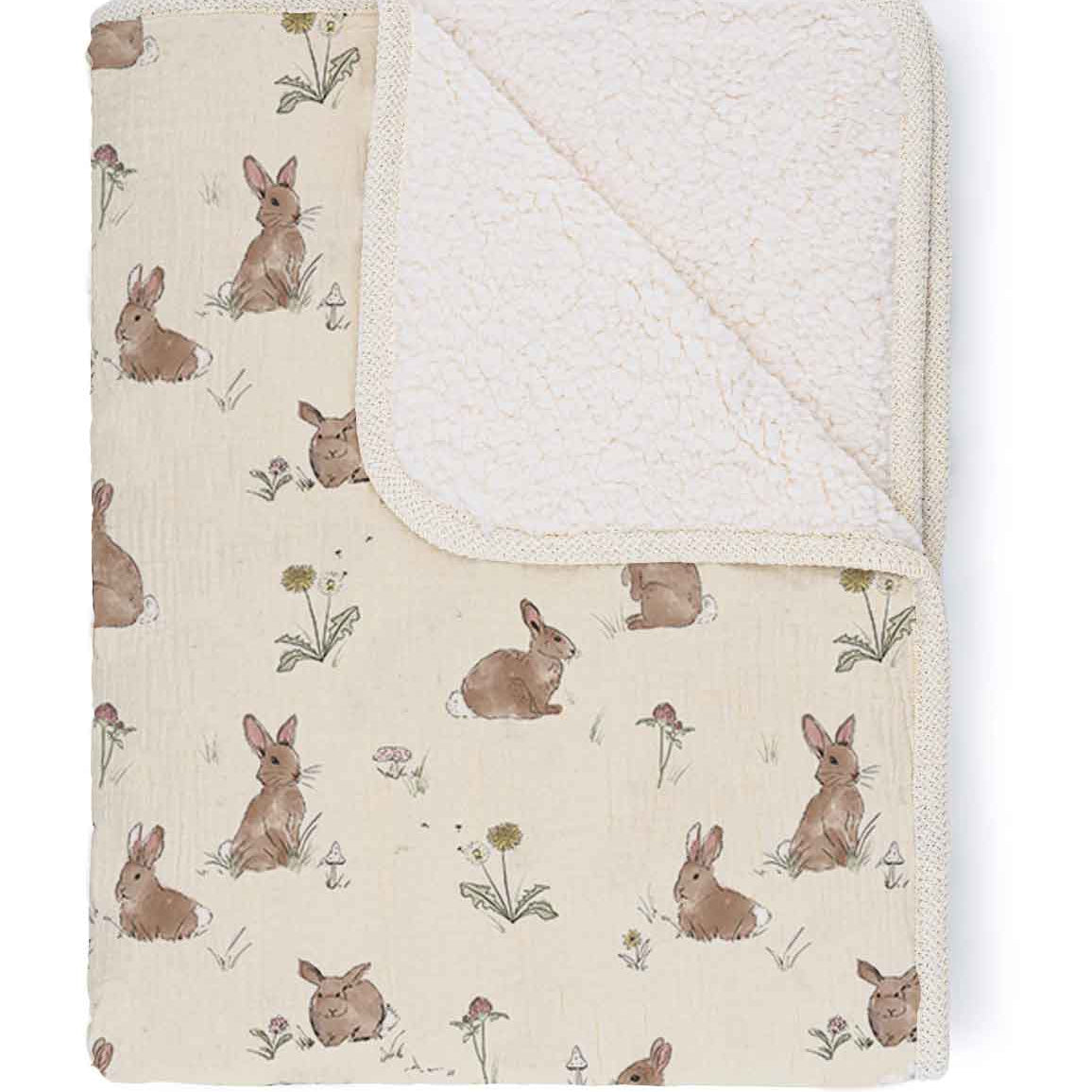 Baby blanket with rabbit pattern on a white background