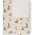 Baby blanket with rabbit pattern on a white background