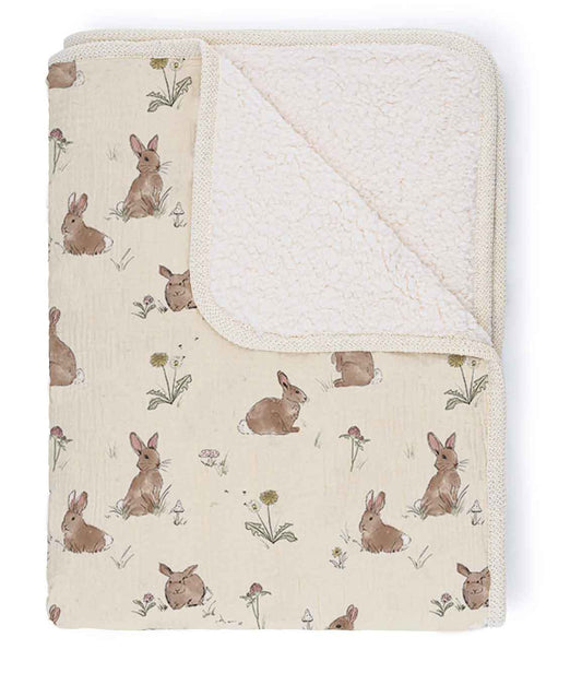 Baby blanket with rabbit pattern on a white background